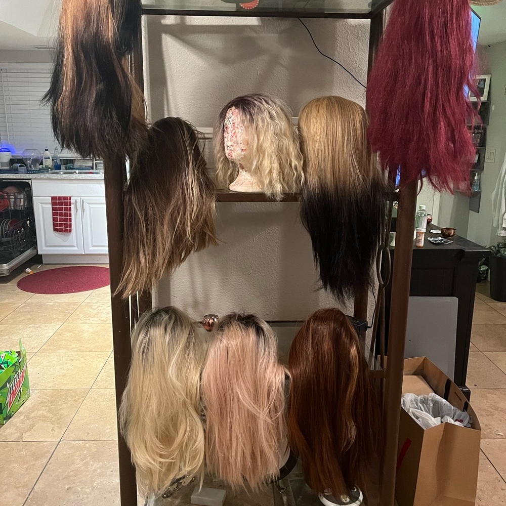 Synthetic and human hair, some used once or twice, other half never worn.